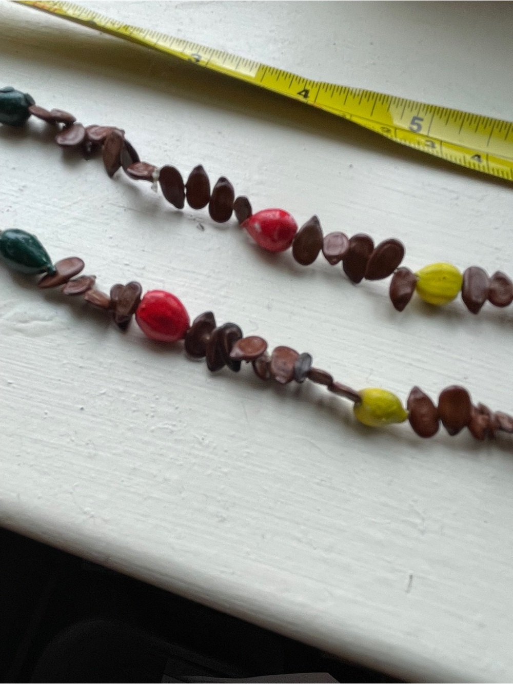 Vintage Ethiopian handcrafted seed necklace featuring hand-painted seeds